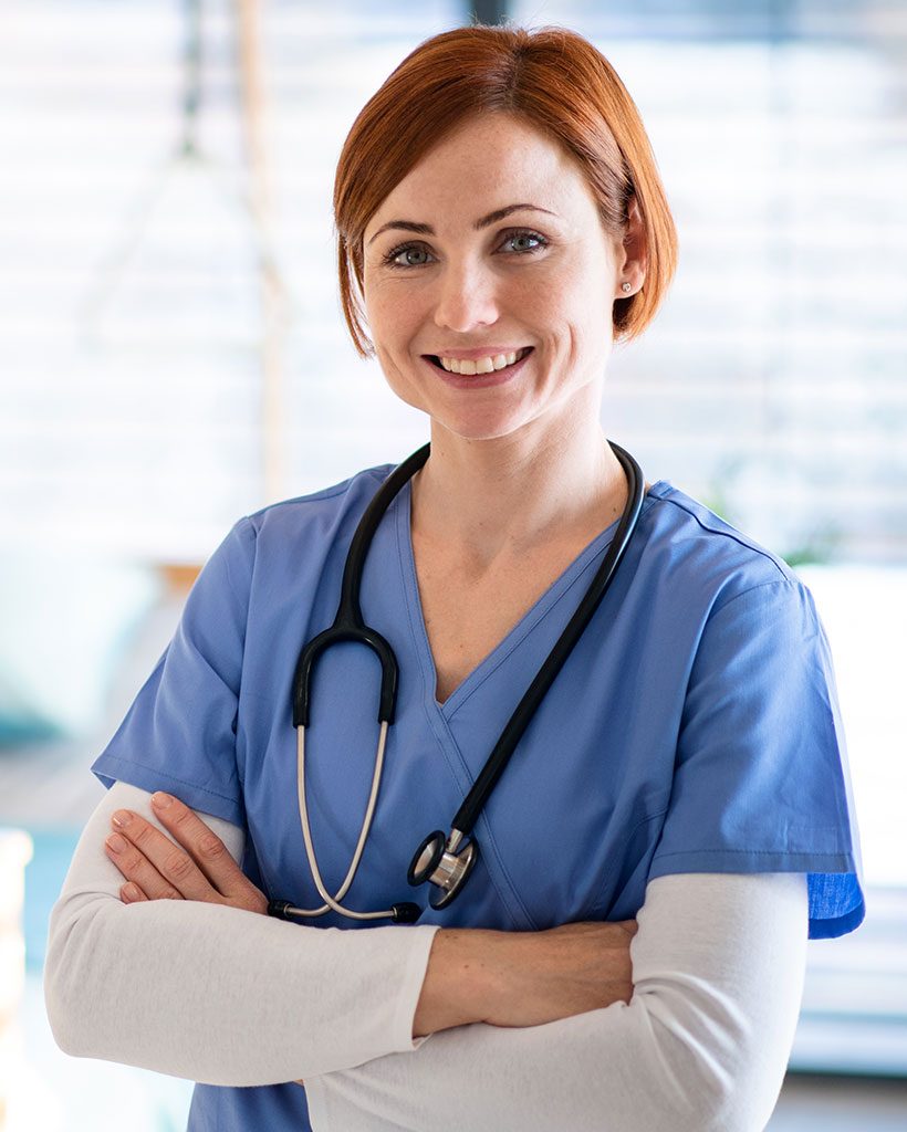 portrait-of-female-doctor-or-nurse-standing-in-hos-J37Z55D.jpg